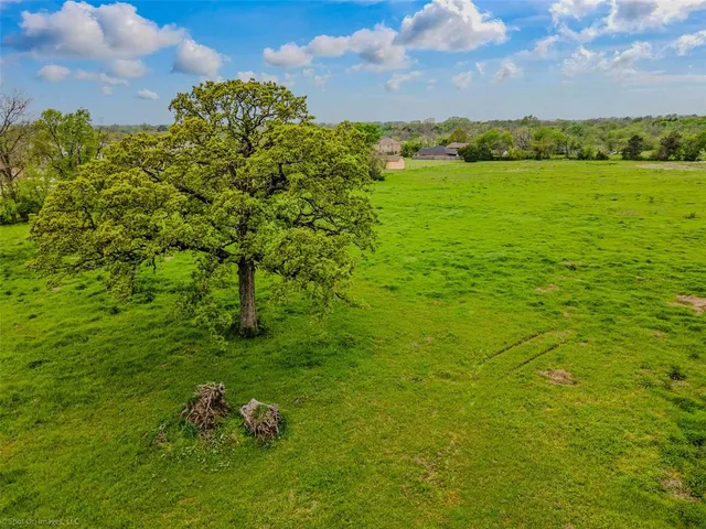 a backyard of a building with lots of green space