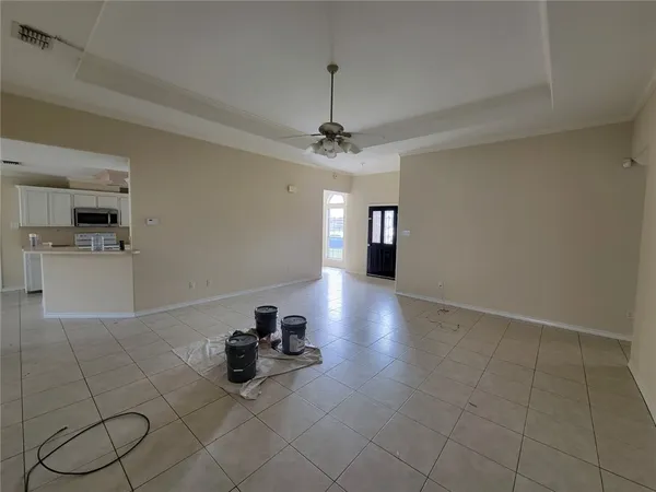 a view of a livingroom with furniture and a ceiling fan
