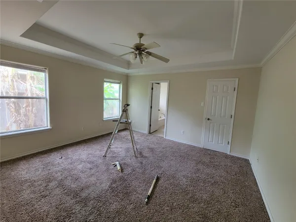 a en suite bathroom with a bathtub and a double vanity sink