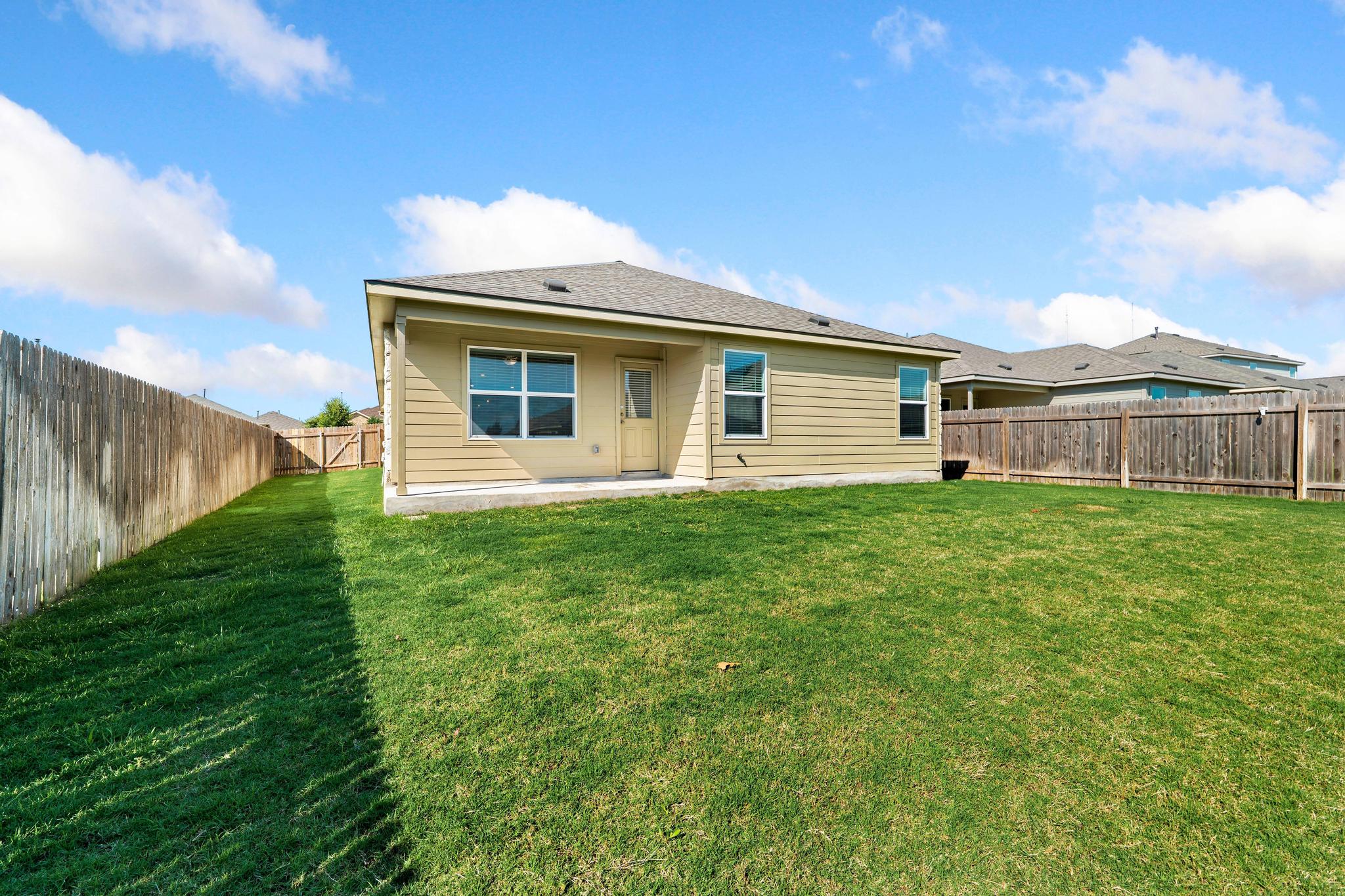 133 Konik Road Georgetown, TX 78626 - Photo 21 of 29 a view of a house with a backyard
