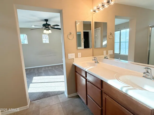 a bathroom with a sink and mirror