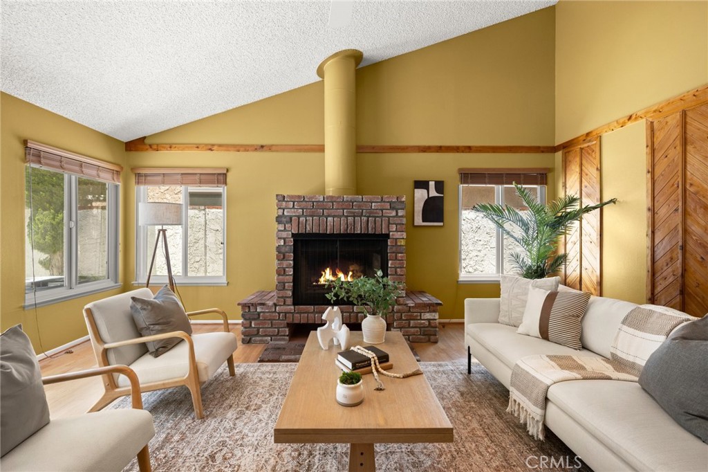 26017 Redbluff Drive Calabasas, CA 91302 - Photo 13 of 29 a living room with furniture and a fireplace