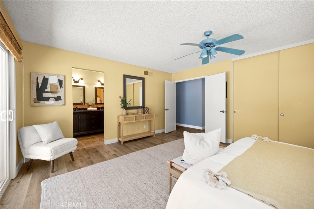 26017 Redbluff Drive Calabasas, CA 91302 - Photo 15 of 29 a bedroom with a bed and a couch