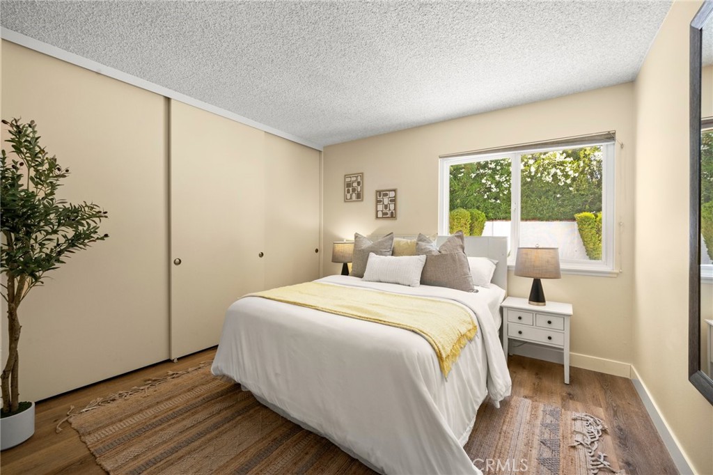 26017 Redbluff Drive Calabasas, CA 91302 - Photo 18 of 29 a bedroom with a bed and a window