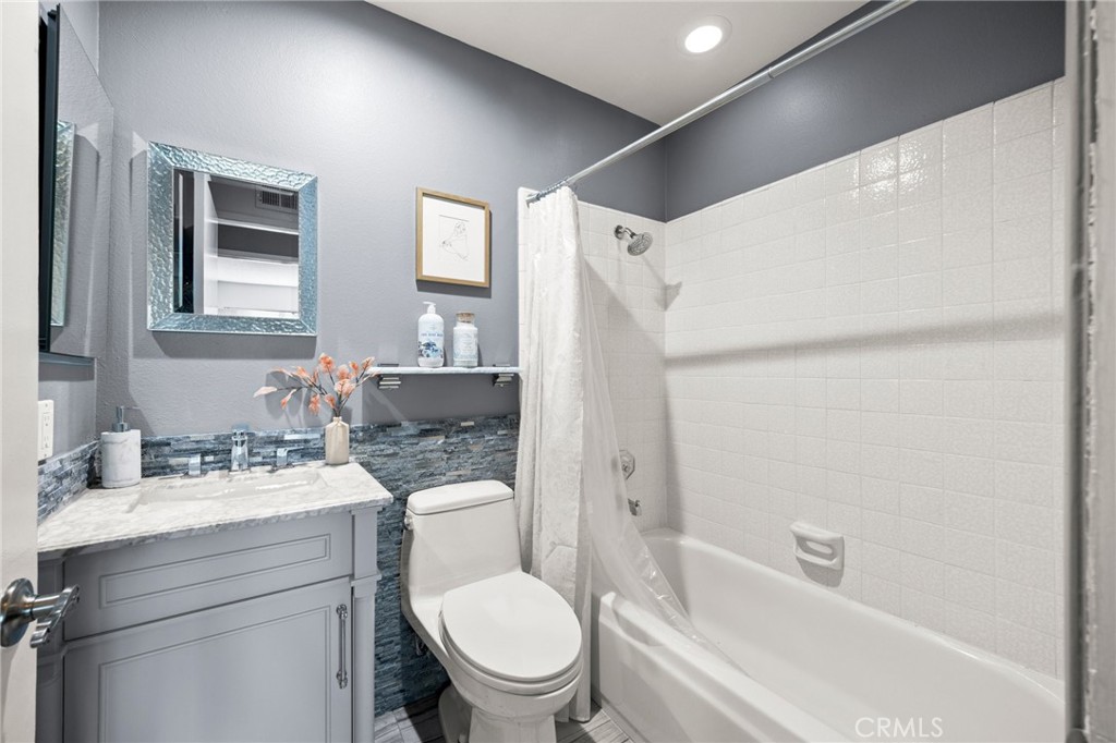 26017 Redbluff Drive Calabasas, CA 91302 - Photo 21 of 29 a bathroom with a sink toilet tub and shower
