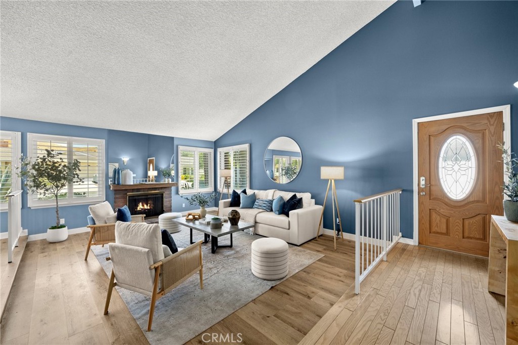 26017 Redbluff Drive Calabasas, CA 91302 - Photo 3 of 29 a living room with fireplace furniture and a large window