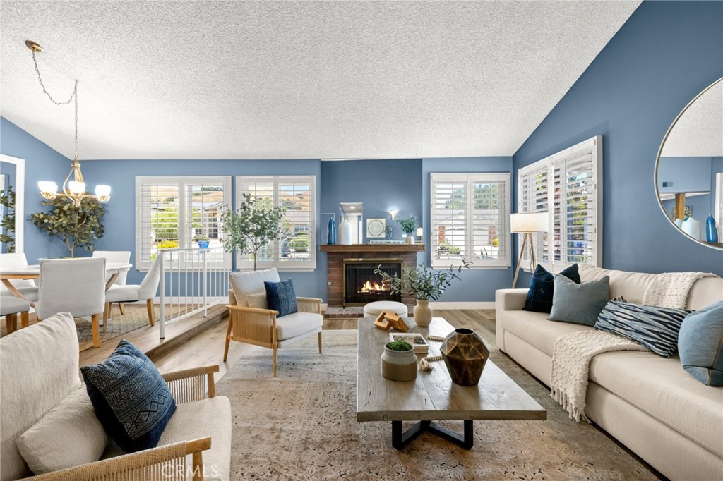 26017 Redbluff Drive Calabasas, CA 91302 - Photo 4 of 29 a living room with furniture large window and a fireplace