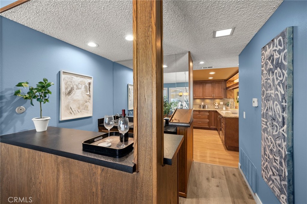 26017 Redbluff Drive Calabasas, CA 91302 - Photo 8 of 29 a living room with furniture and flowers