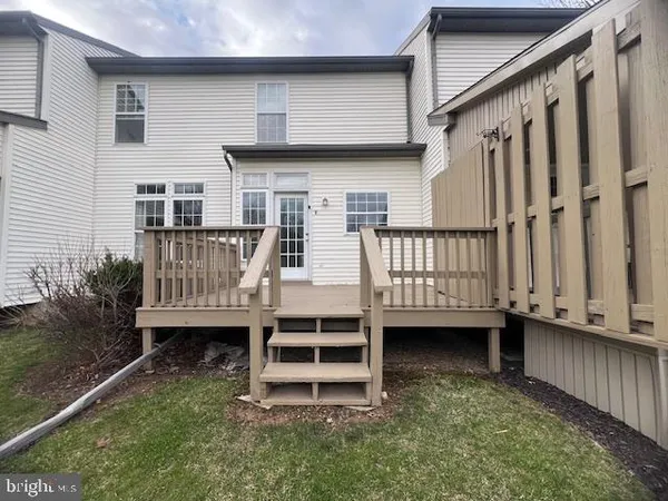 a view of a house with backyard and porch