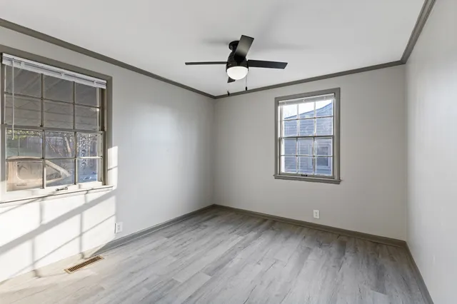a bathroom with a sink toilet vanity and bathtub