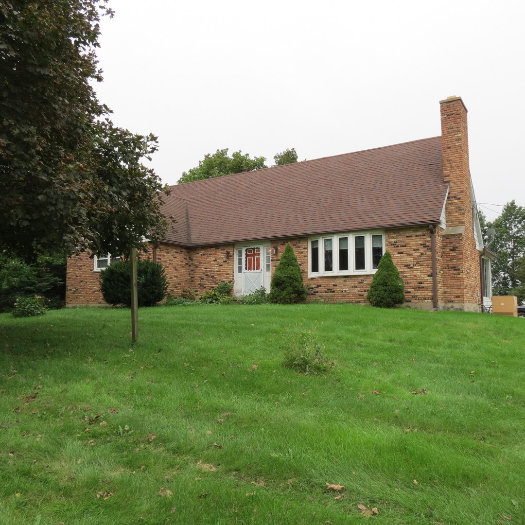 27160 South Center Road Monee, IL 60449 - Photo 1 of 7 a house that is sitting in the grass