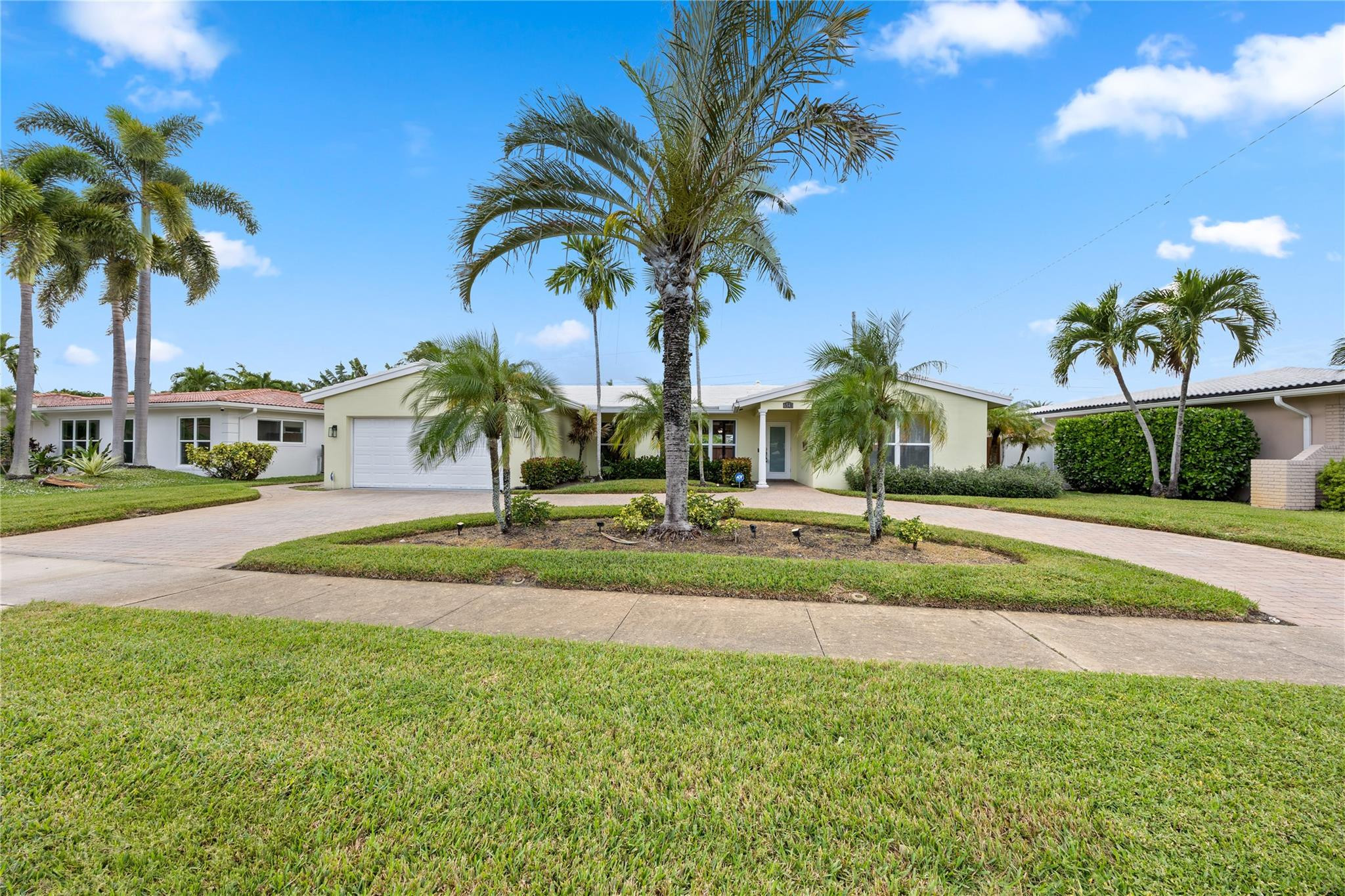 6543 Northeast 21st Road Fort Lauderdale, FL 33308 - Photo 2 of 38 a view of a palm trees in front of a house