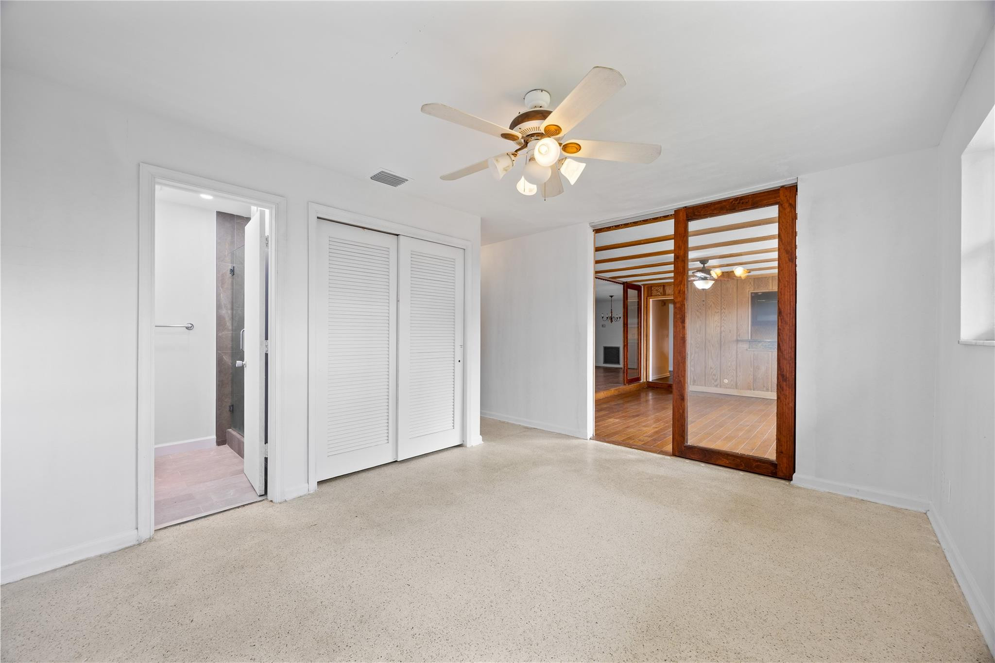 6543 Northeast 21st Road Fort Lauderdale, FL 33308 - Photo 21 of 38 a view of an empty room with a chandelier