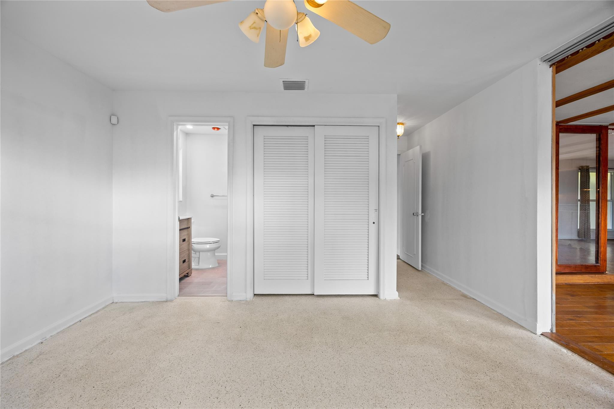 6543 Northeast 21st Road Fort Lauderdale, FL 33308 - Photo 22 of 38 an empty room with a empty space and a ceiling fan