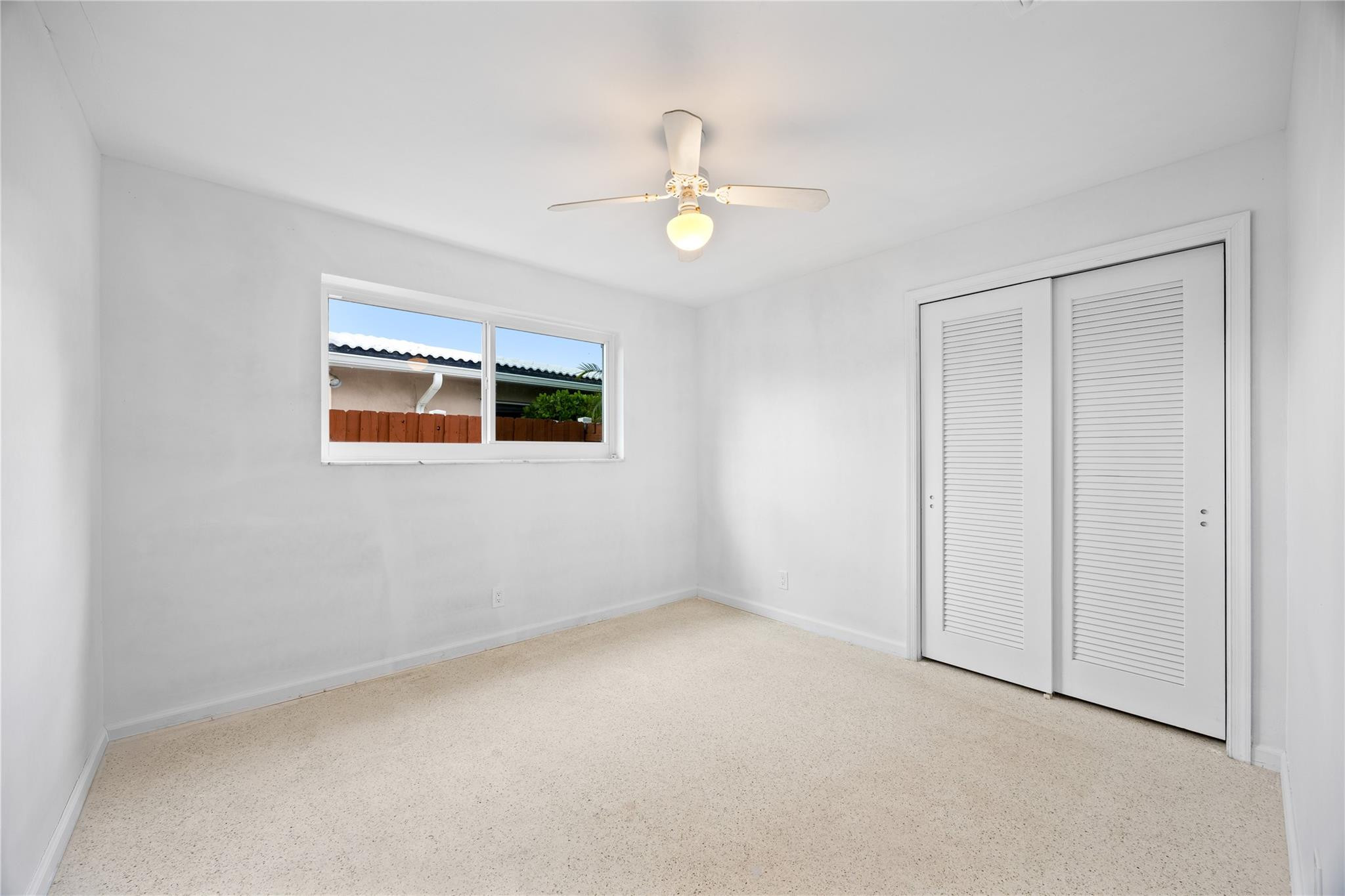 6543 Northeast 21st Road Fort Lauderdale, FL 33308 - Photo 27 of 38 a view of an empty room with a window
