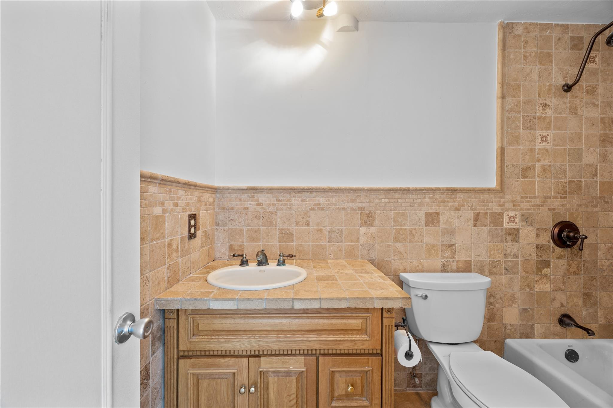 6543 Northeast 21st Road Fort Lauderdale, FL 33308 - Photo 31 of 38 a bathroom with a sink toilet and a mirror