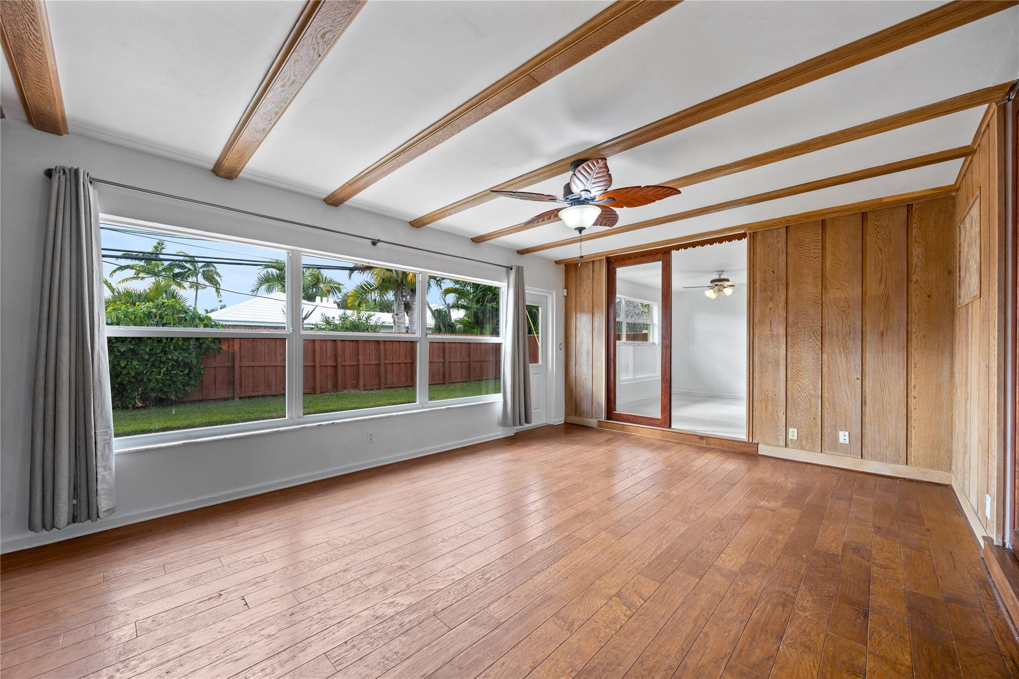 6543 Northeast 21st Road Fort Lauderdale, FL 33308 - Photo 35 of 38 an empty room with wooden floor and windows
