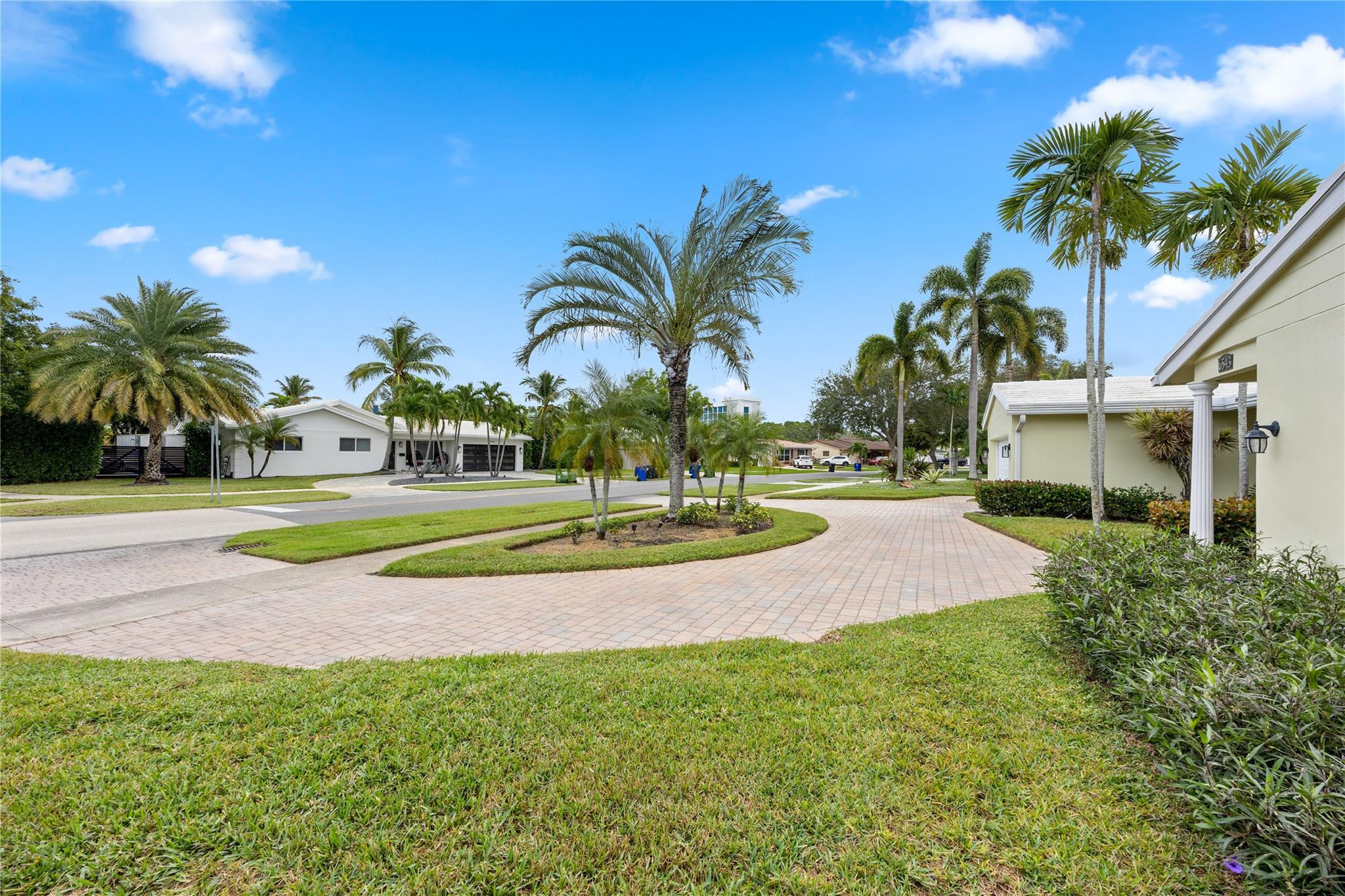 6543 Northeast 21st Road Fort Lauderdale, FL 33308 - Photo 6 of 38 a view of a swimming pool with a yard and palm trees