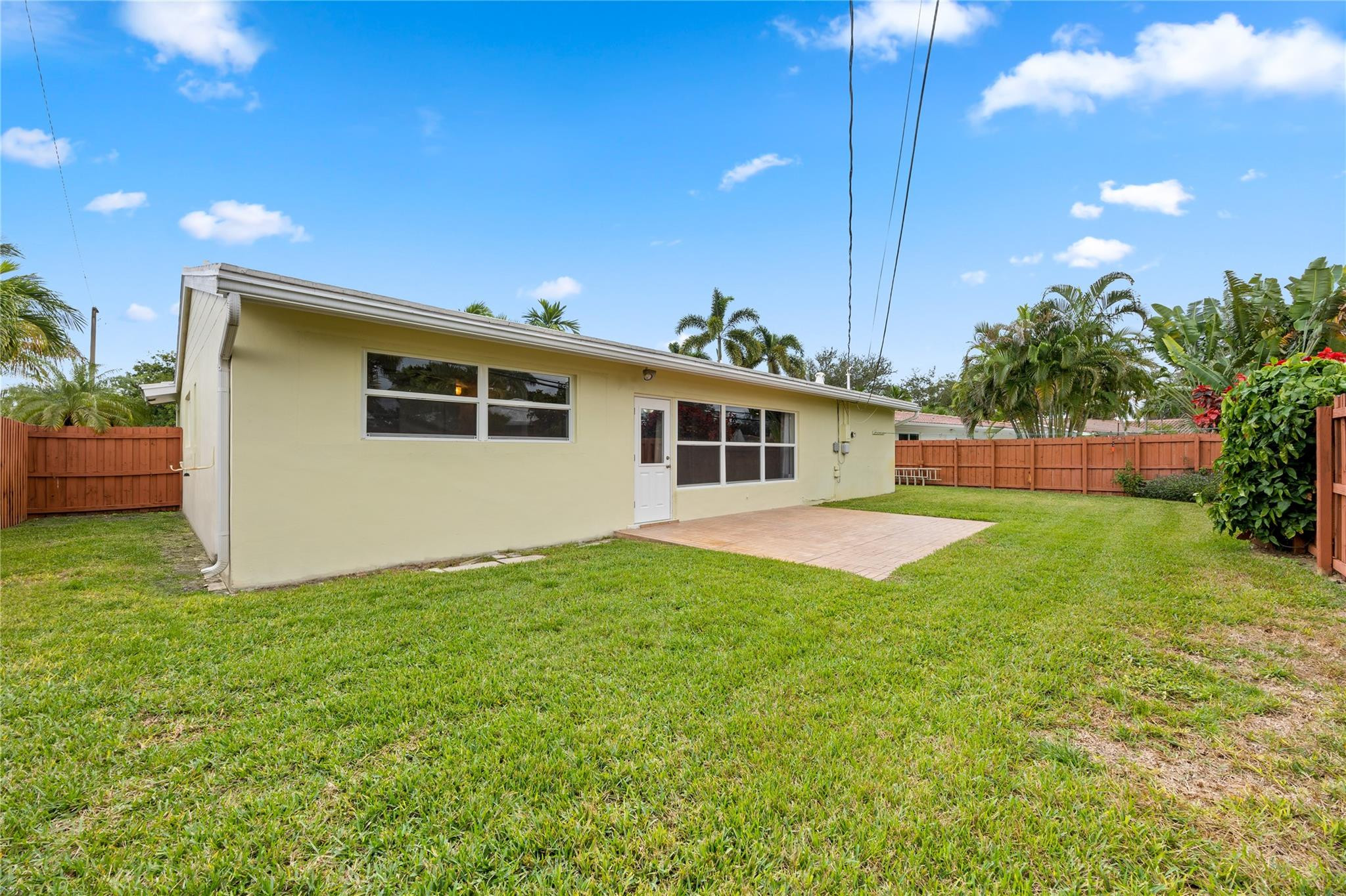 6543 Northeast 21st Road Fort Lauderdale, FL 33308 - Photo 9 of 38 a view of a house with backyard