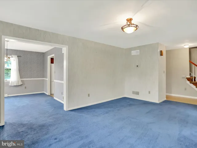 an empty room with a view of a bathroom