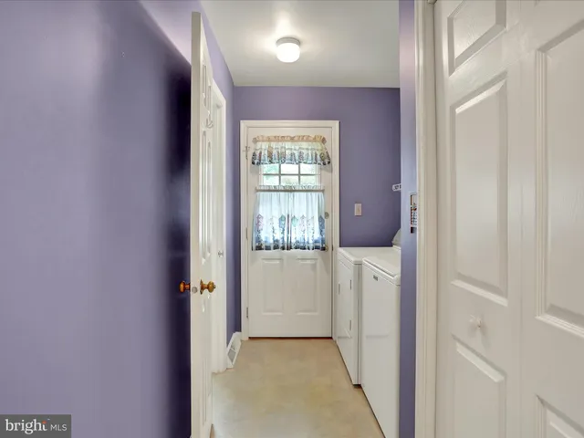 a hallway with white doors