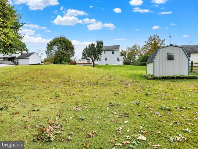 a view of a big yard with a house