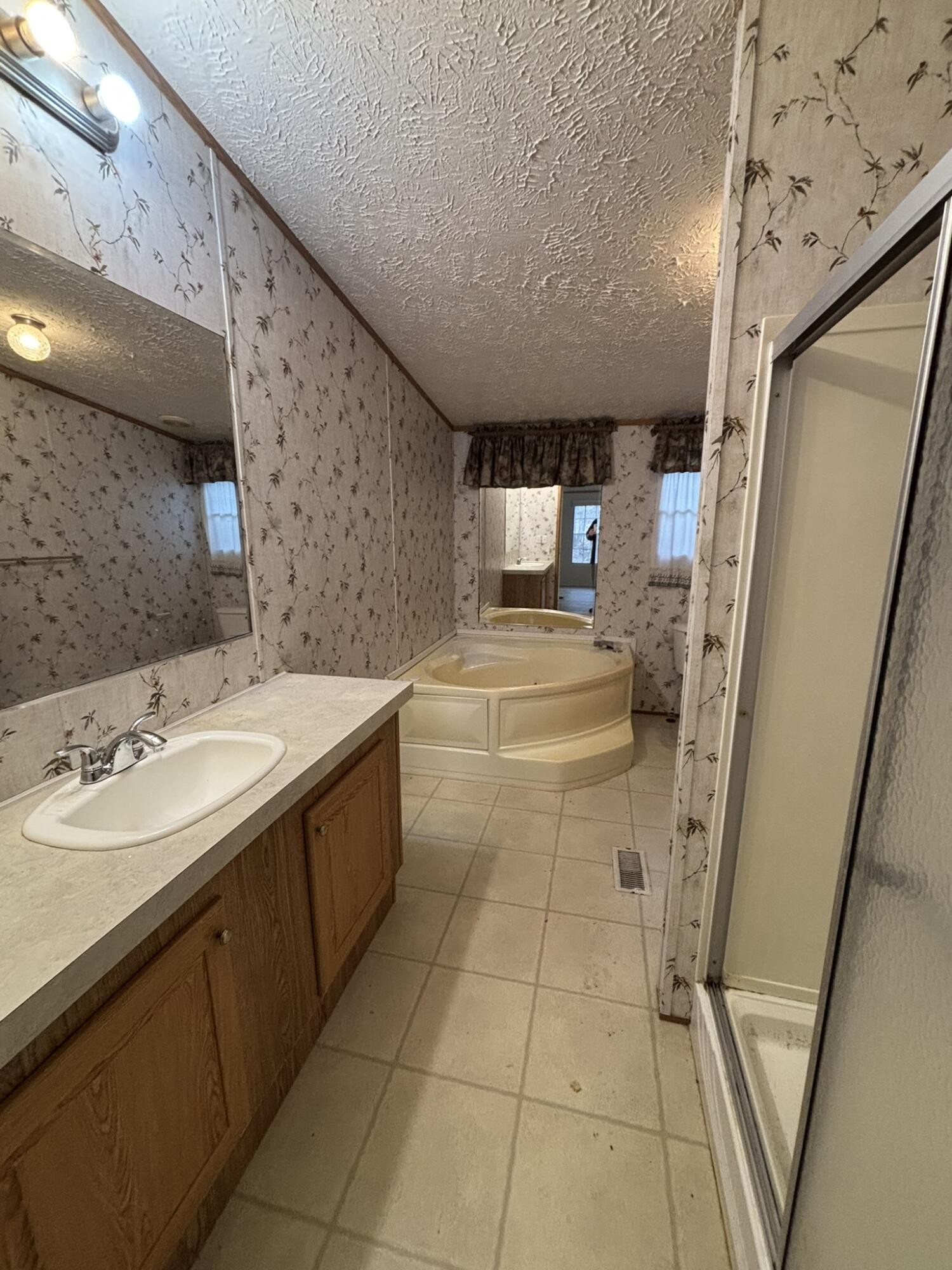 4099 Chatata Valley Road Northeast Charleston, TN 37310 - Photo 16 of 17 a bathroom with a sink a toilet and mirror