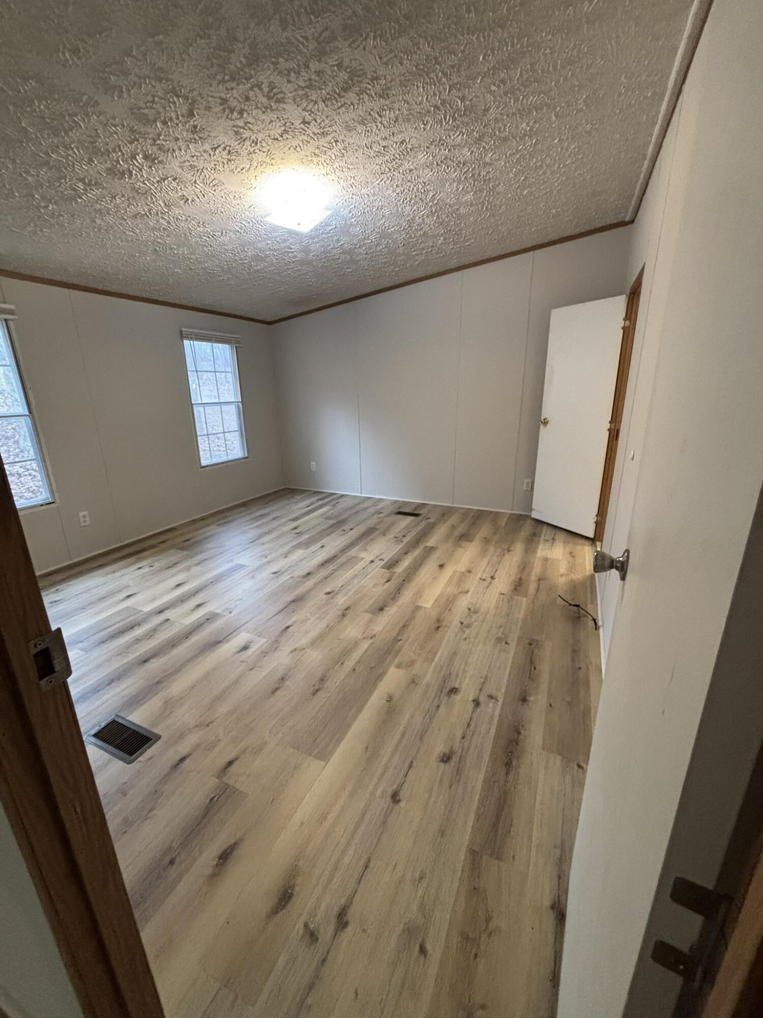 4099 Chatata Valley Road Northeast Charleston, TN 37310 - Photo 9 of 17 a view of empty room with wooden floor