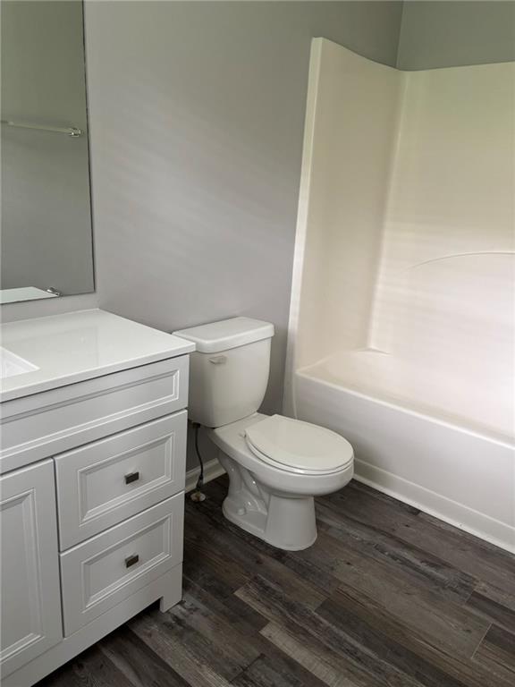 5739 Windfall Lane Lithonia, GA 30058 - Photo 24 of 36 a bathroom with a toilet and a vanity