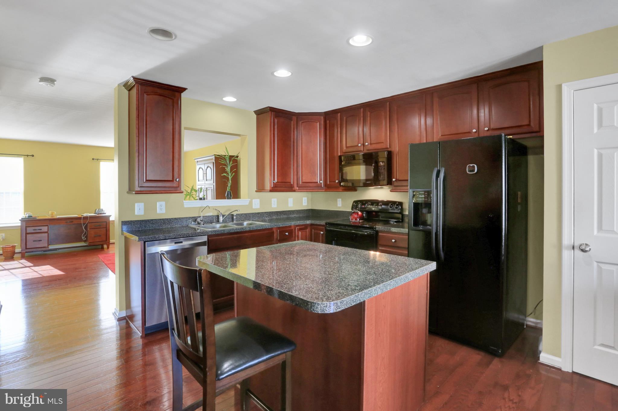 1219 Steed Street Ranson, WV 25438 - Photo 4 of 30 a kitchen with stainless steel appliances granite countertop a refrigerator a stove a sink a table and chairs