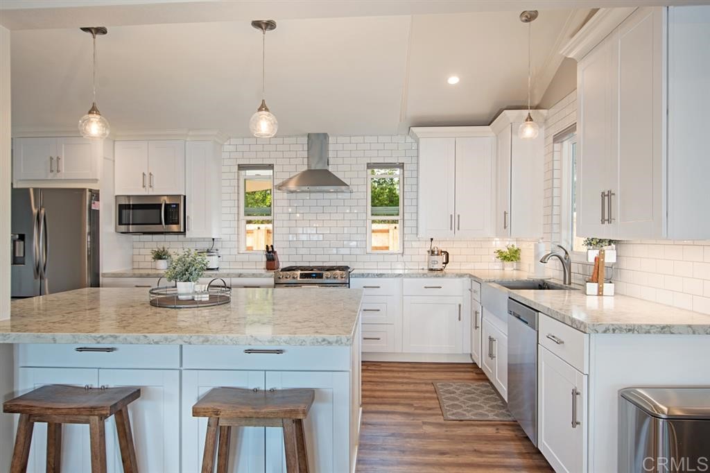 3701 Catalina Drive Carlsbad, CA 92010 - Photo 11 of 25 a kitchen with lots of counter space appliances and cabinets