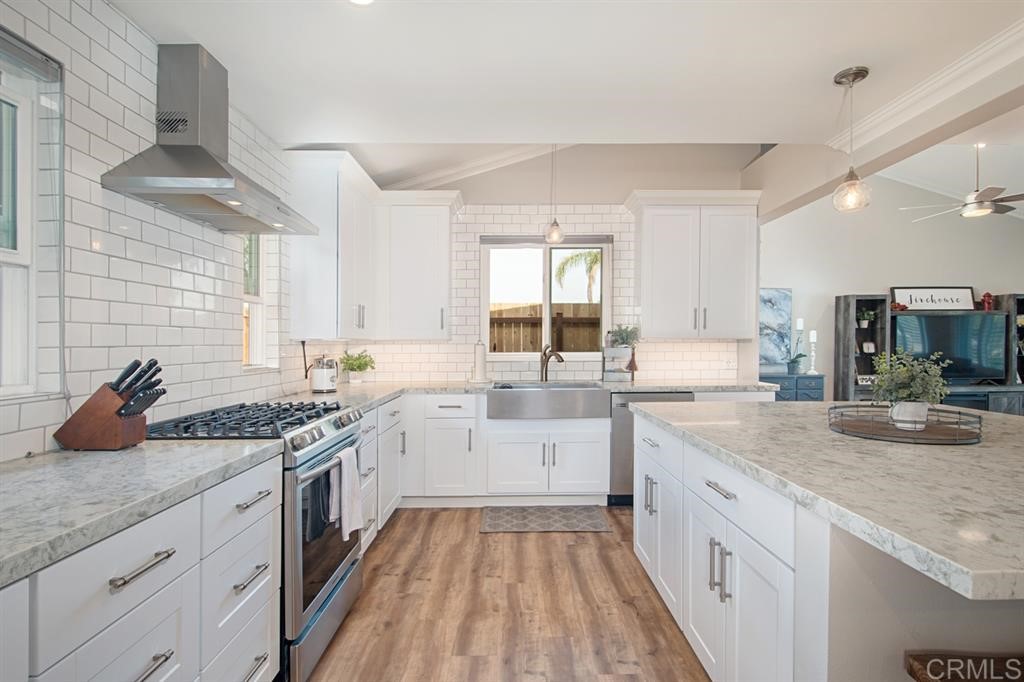 3701 Catalina Drive Carlsbad, CA 92010 - Photo 12 of 25 a kitchen with sink stove and cabinets