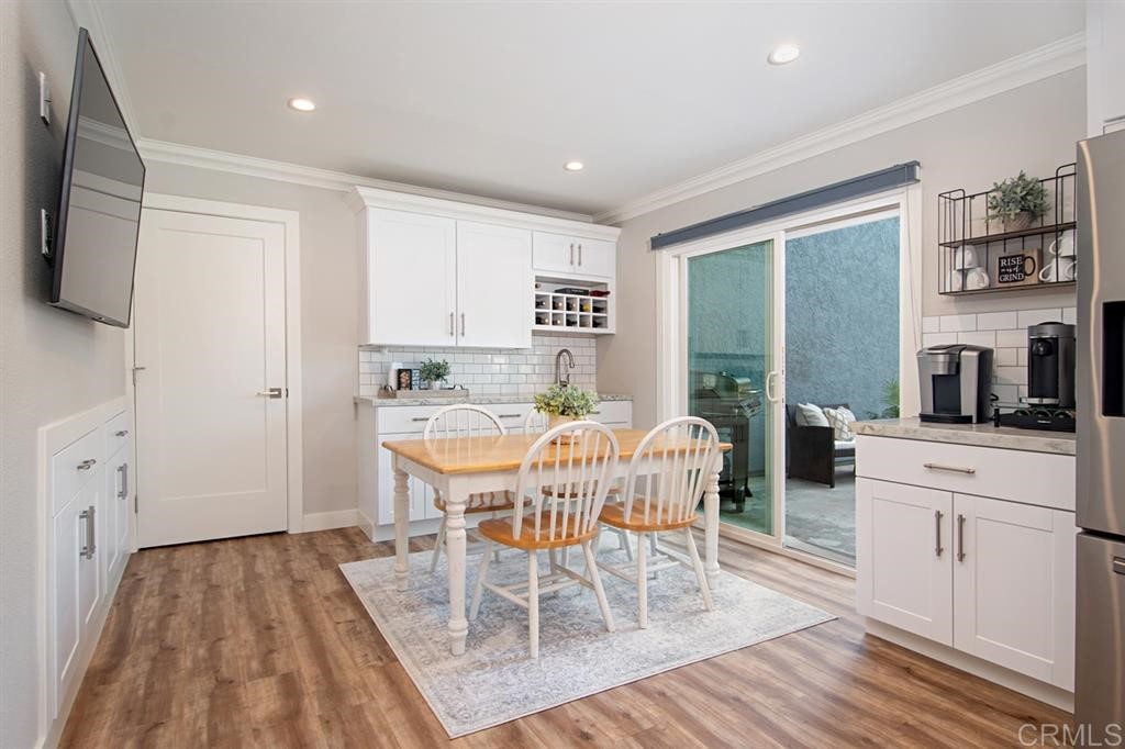 3701 Catalina Drive Carlsbad, CA 92010 - Photo 14 of 25 a dining room with furniture and wooden floor