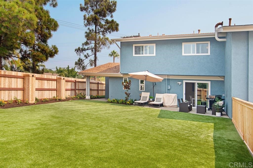 3701 Catalina Drive Carlsbad, CA 92010 - Photo 16 of 25 a view of a house with a yard and sitting area
