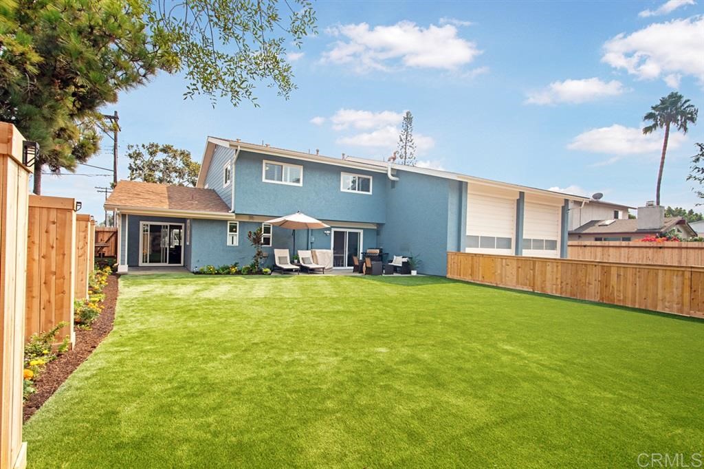 3701 Catalina Drive Carlsbad, CA 92010 - Photo 17 of 25 a front view of a house with a garden and plants