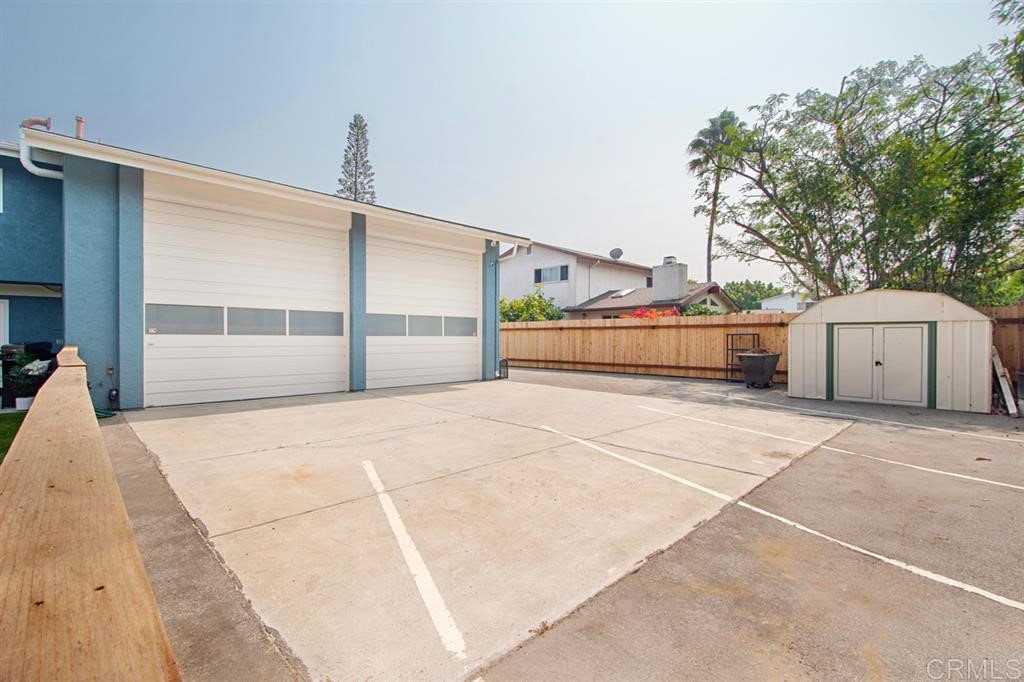 3701 Catalina Drive Carlsbad, CA 92010 - Photo 18 of 25 a view of a house with a yard and garage