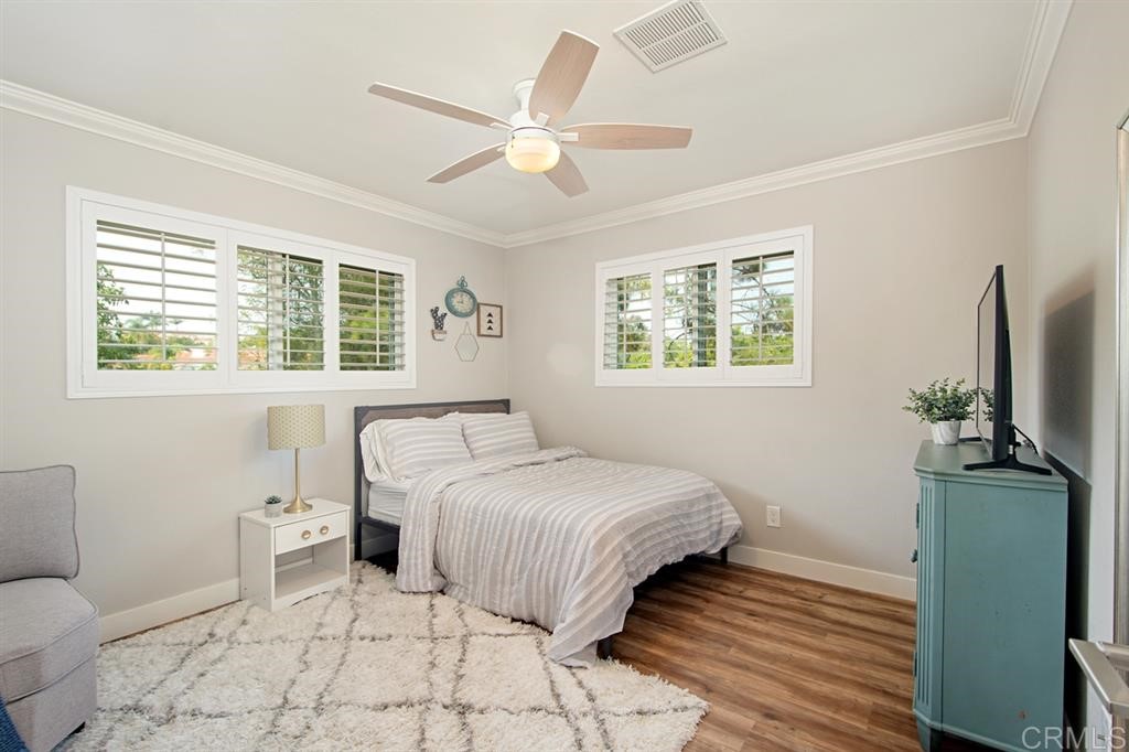 3701 Catalina Drive Carlsbad, CA 92010 - Photo 23 of 25 a bedroom with a bed and a flat screen tv