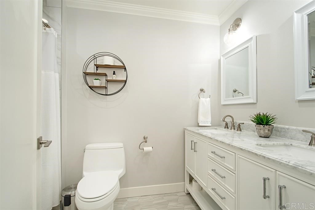 3701 Catalina Drive Carlsbad, CA 92010 - Photo 25 of 25 a bathroom with a granite countertop toilet sink and mirror