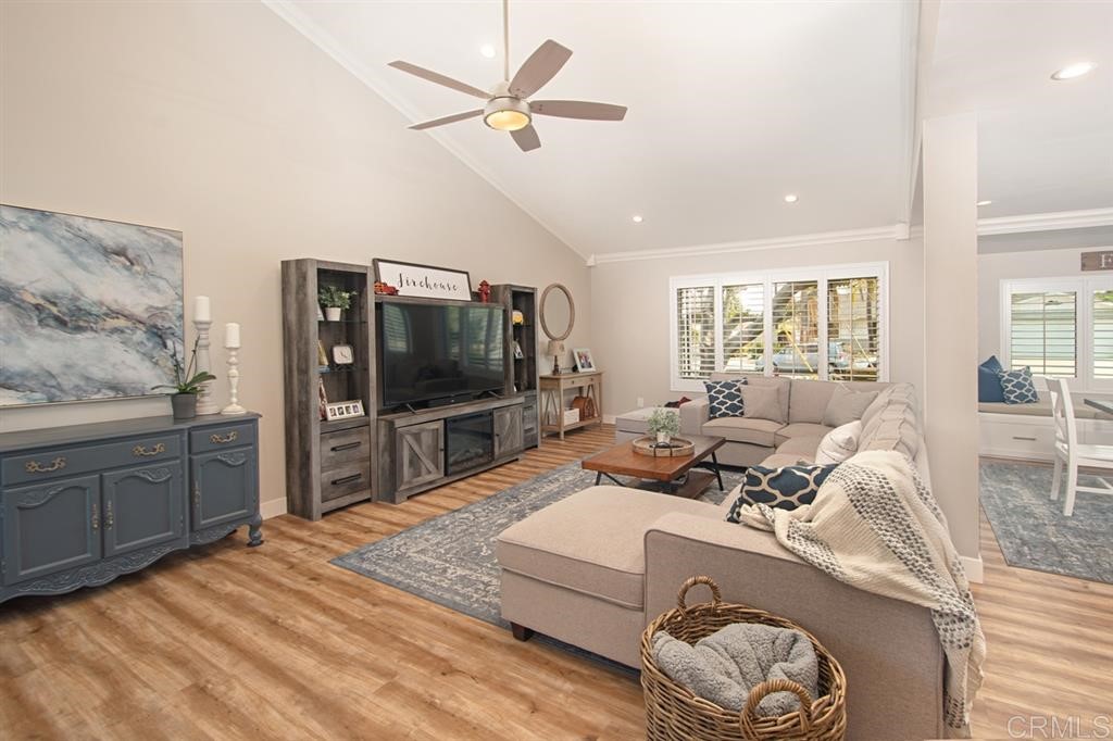 3701 Catalina Drive Carlsbad, CA 92010 - Photo 6 of 25 a living room with furniture and a flat screen tv