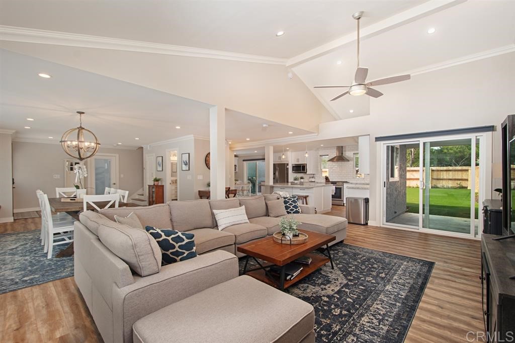 3701 Catalina Drive Carlsbad, CA 92010 - Photo 7 of 25 a living room with furniture a table and a chandelier