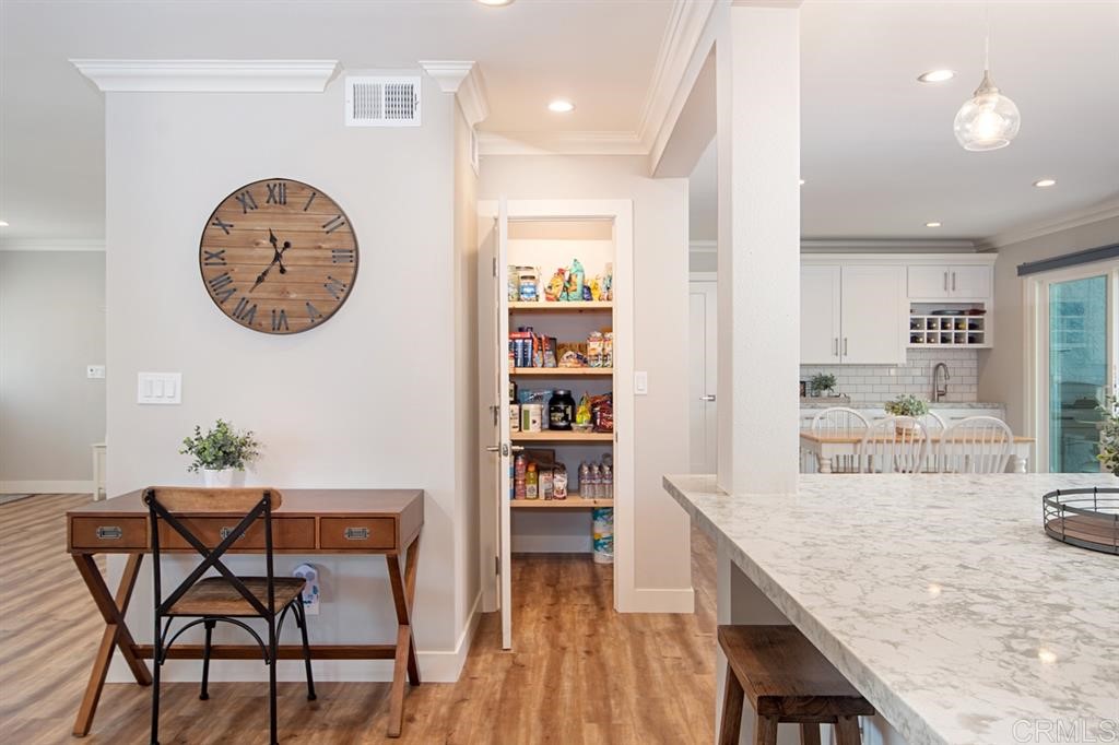 3701 Catalina Drive Carlsbad, CA 92010 - Photo 10 of 25 a view of a dining room with furniture and wooden floor