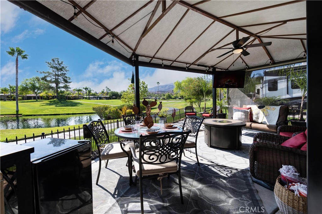a view of a patio with a table chairs and a table