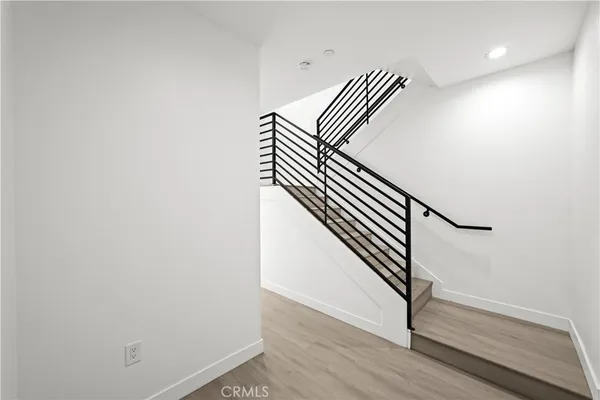 a view of entryway with wooden floor
