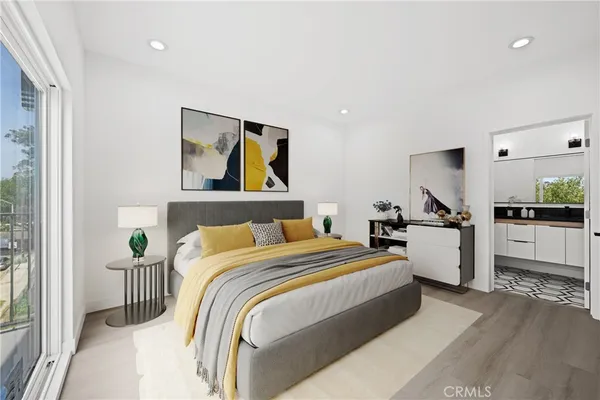 a bedroom with bed and cupboard