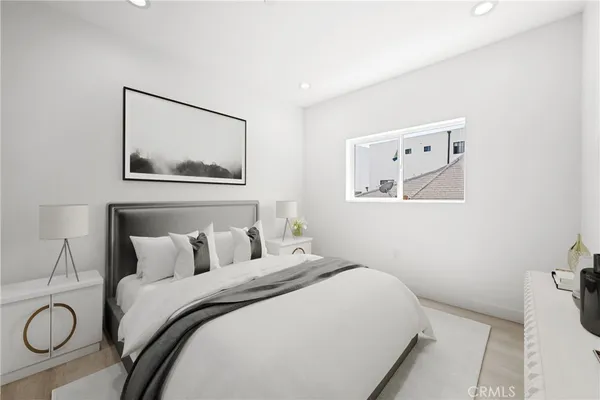 a view of a room with wooden floor and a window