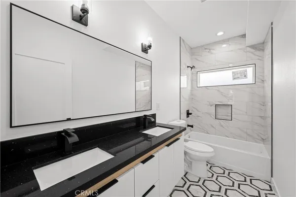 a close view of a sink a counter space and utility room