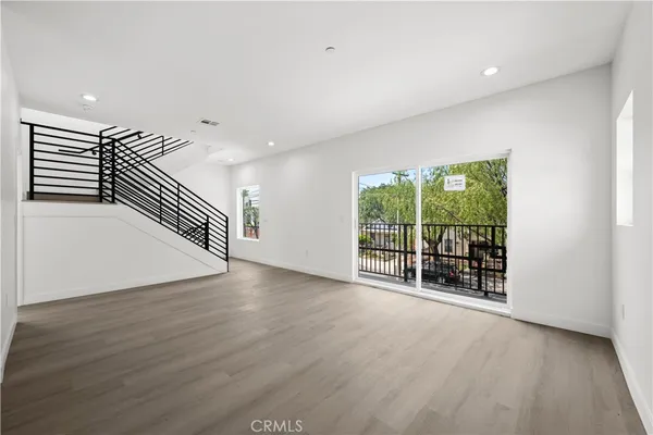 an entryway in a hall with a window