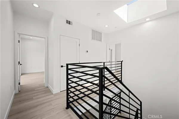 a view of an entryway with wooden floor