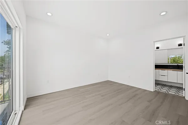 a bathroom with a granite countertop sink a toilet a vanity and bathtub