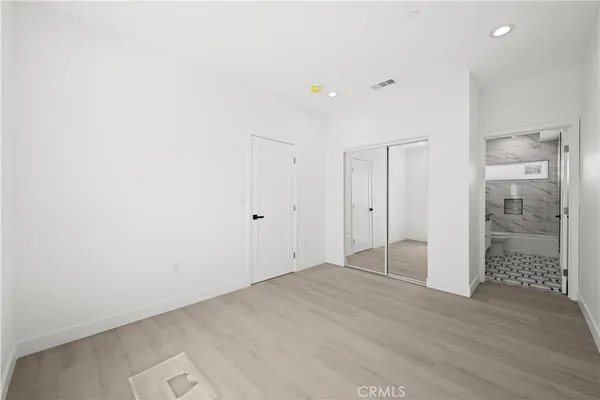 a bathroom with a sink a toilet a shower and a mirror